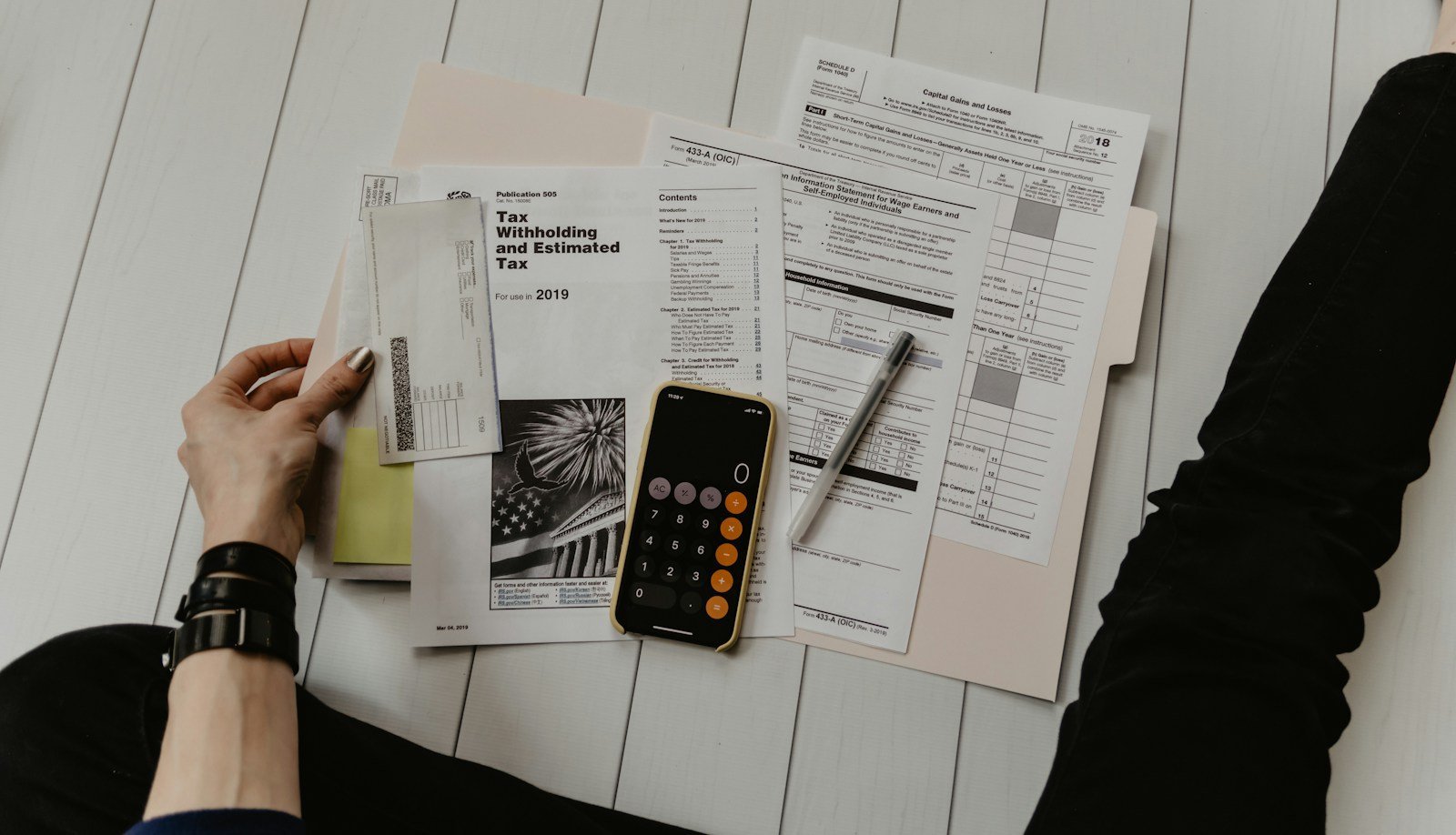 Tax paperwork illustrating how to manage graduate school during tax season