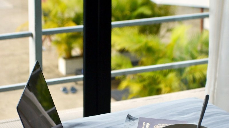 Travel workspace illustrating how to prepare for a doctoral residency while working