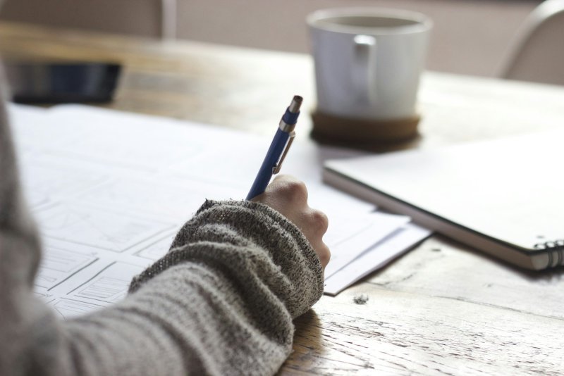 Professional studying how to prepare for graduate comprehensive exams while working full time